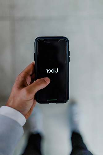 cell phone person holding black smartphone mobile phone
